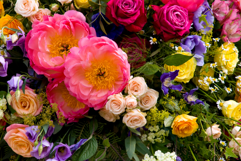 Close-up view of a flower arrangement featuring pink, purple, and yellow flowers