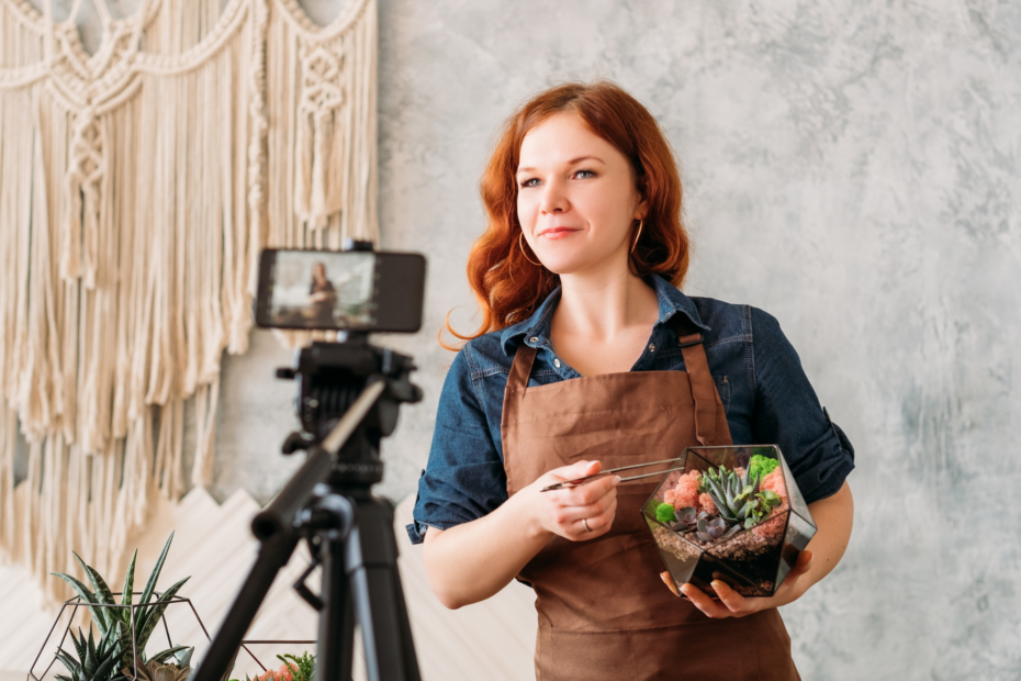 Florist recording a video with a phone on a tripod