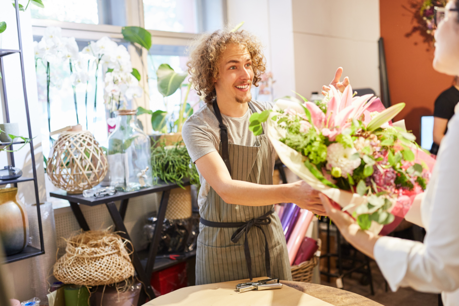 Florist handing bouquet to customer