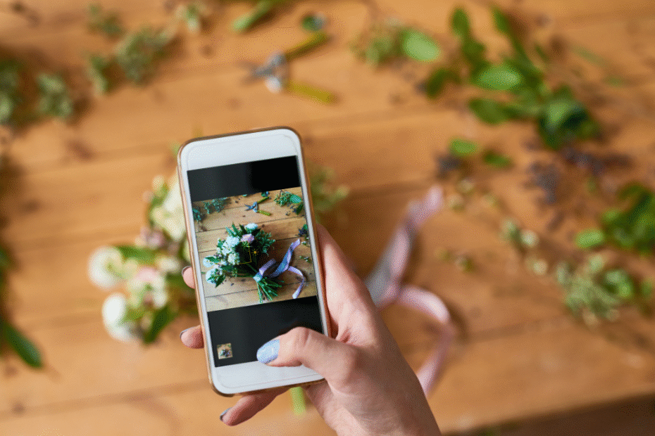 phone taking a picture of flowers