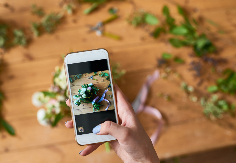 phone taking a picture of flowers