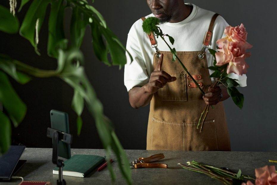 Don’t Overthink Your Reels! 1 male florist arranging flowers with a phone set up on a tripod